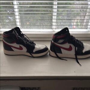Black and White High-Top Sneakers with Red Accents